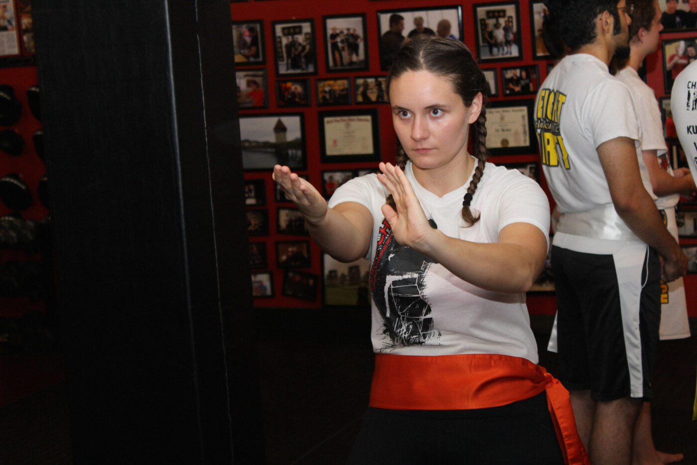 beginner wing chun student practicing a martial arts technique in class