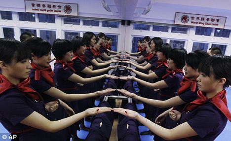 The world's deadliest cabin staff: Passengers will certainly think twice about confronting an air stewardess from Hong Kong Airlines