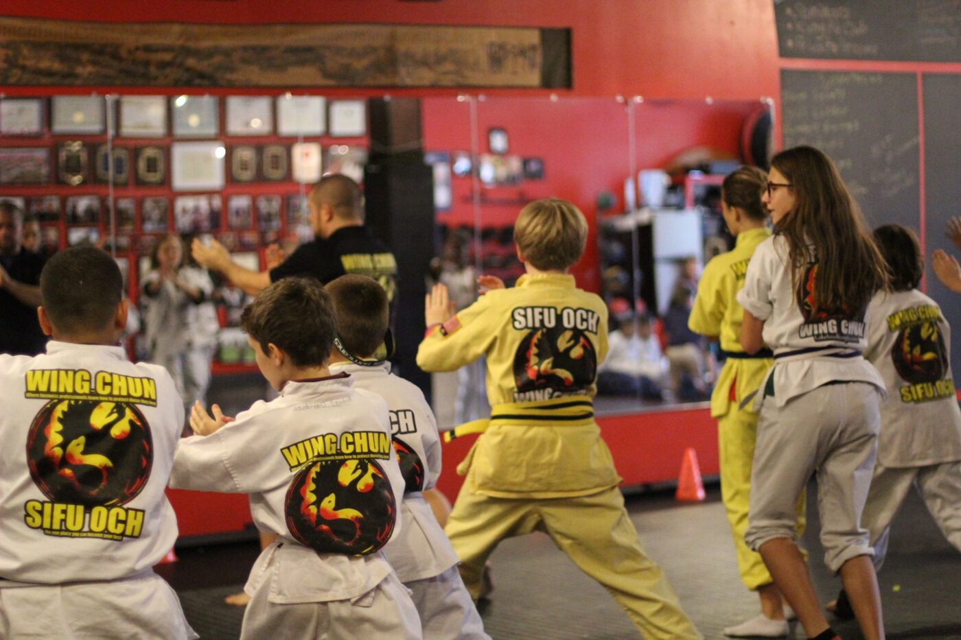 kids in martial arts uniform practicing wing chun